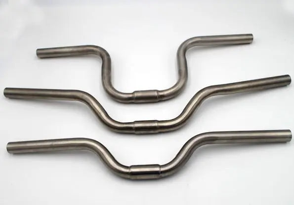 Titanium riser bar outlet